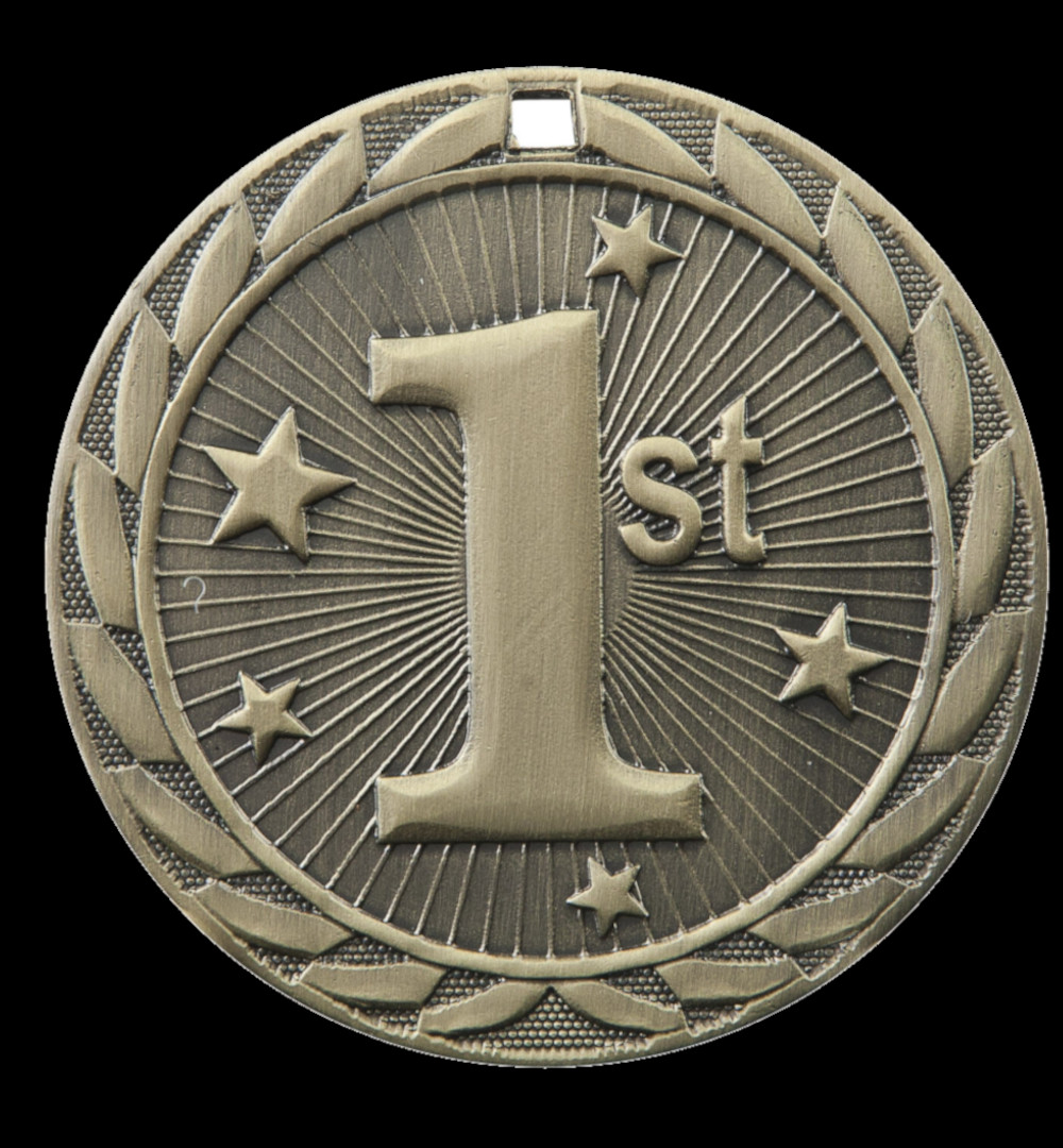 A student sits on stairs in front of a stone building